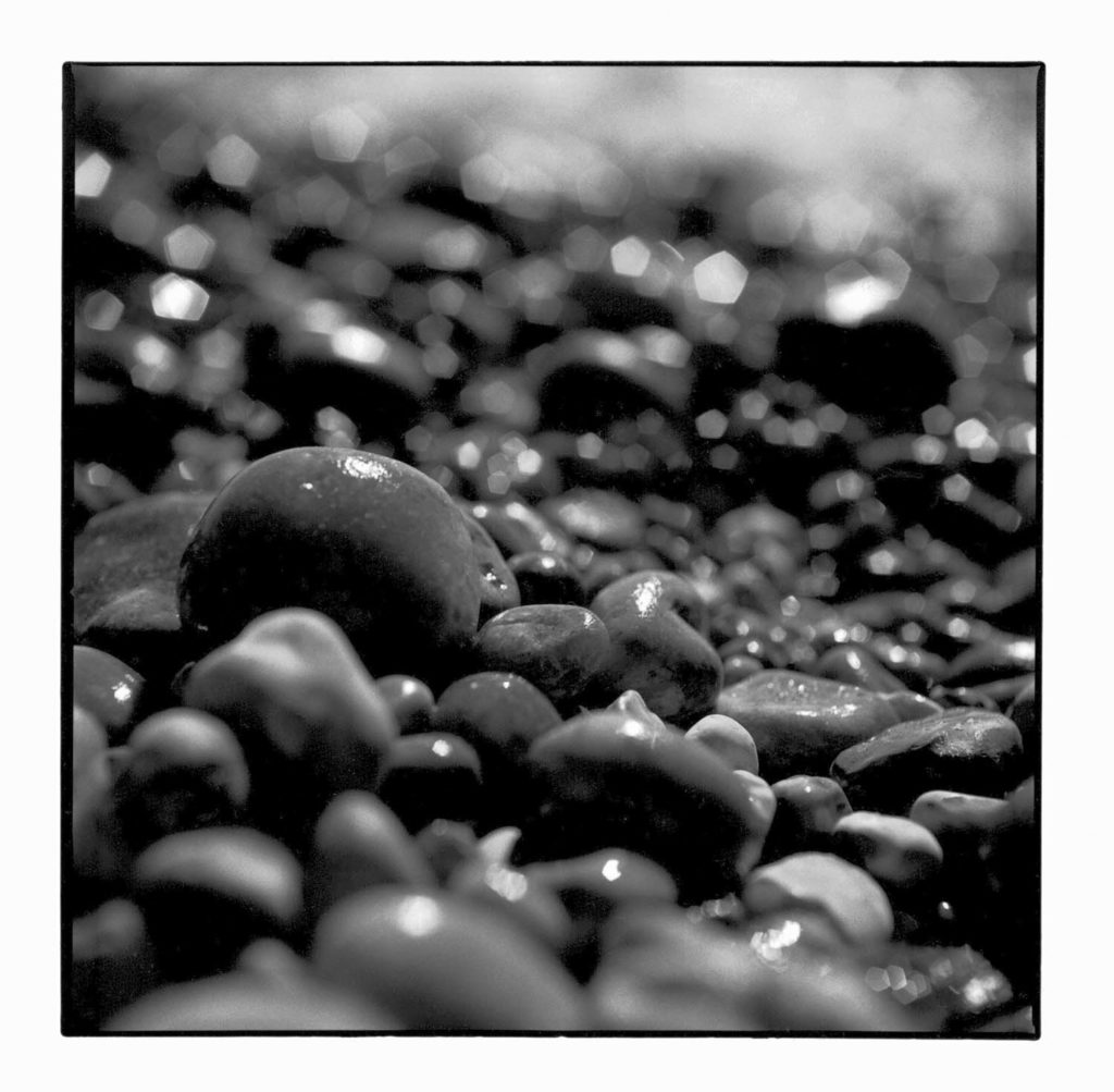 The darkroom gallery - wet stones on a beach in Bournemouth, UK, black and white art photography, black and white art photography prints, black and white art photography for sale, black and white art photography prints for sale, black and white photo prints uk, black and white wall art, black and white photo for wall, black and white framed prints for living room, black and white photo prints, black and white photo prints uk, Black and White Photography Art Prints for Sale,